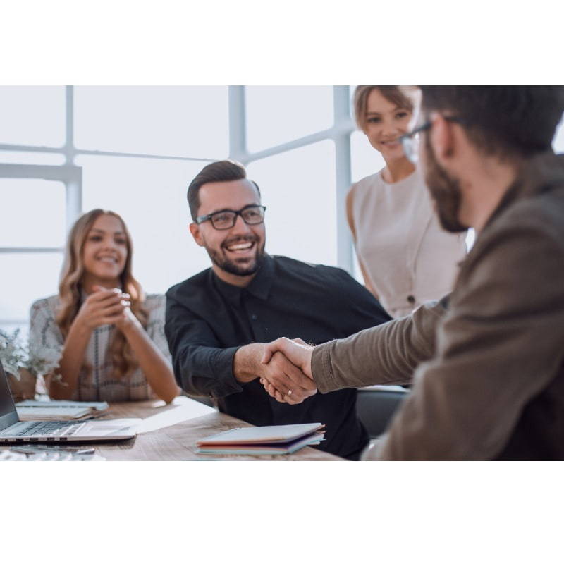 man shakes hand in successful meeting